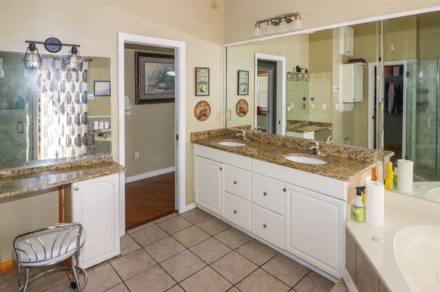 bathroom featuring tile patterned flooring, vanity, and independent shower and bath