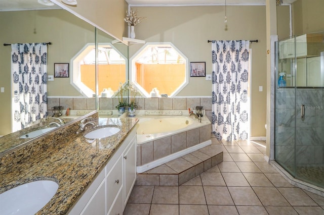 bathroom with plus walk in shower, tile patterned flooring, and vanity