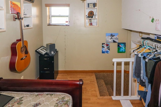 bedroom with hardwood / wood-style flooring