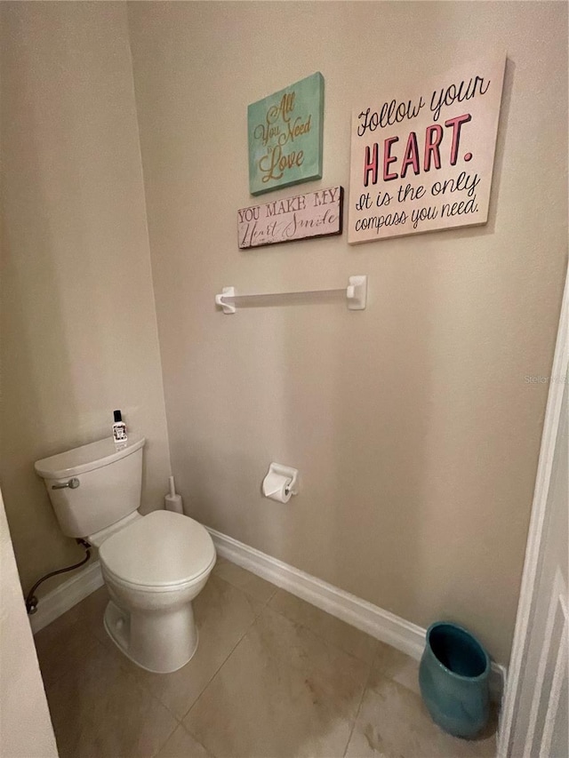 bathroom featuring tile patterned floors and toilet