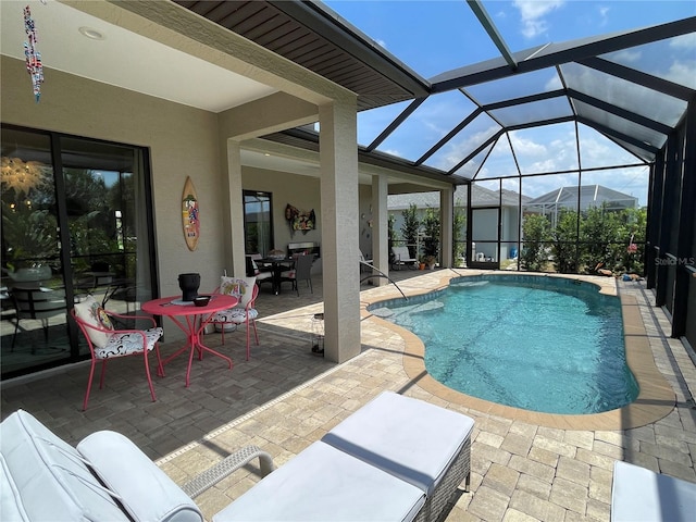 view of swimming pool with a lanai, a mountain view, and a patio