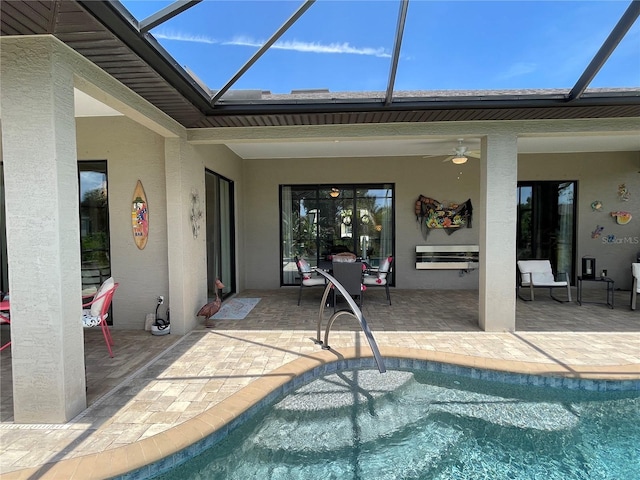 view of pool with ceiling fan and a patio area