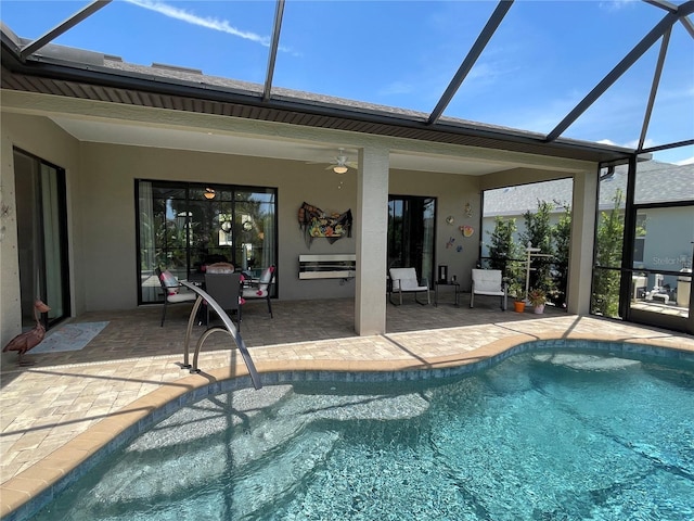 view of pool featuring a patio and glass enclosure