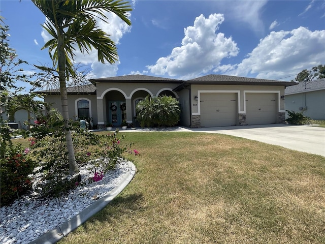 view of front of home with a garage and a front yard