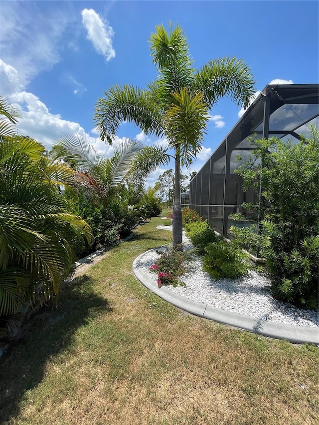 view of yard featuring a lanai