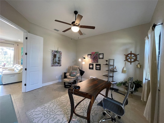 office space with ceiling fan and light tile patterned floors