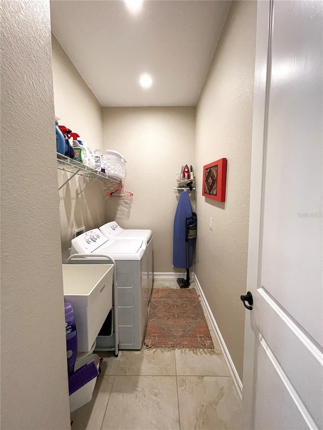 laundry room featuring separate washer and dryer and sink