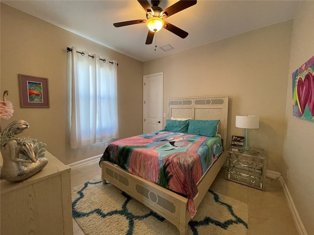 bedroom with light tile patterned floors and ceiling fan