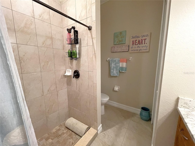 bathroom with vanity, curtained shower, and toilet