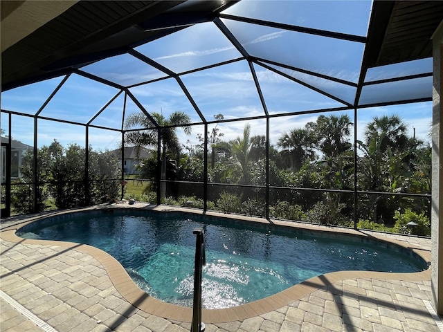 view of pool with a lanai and a patio area