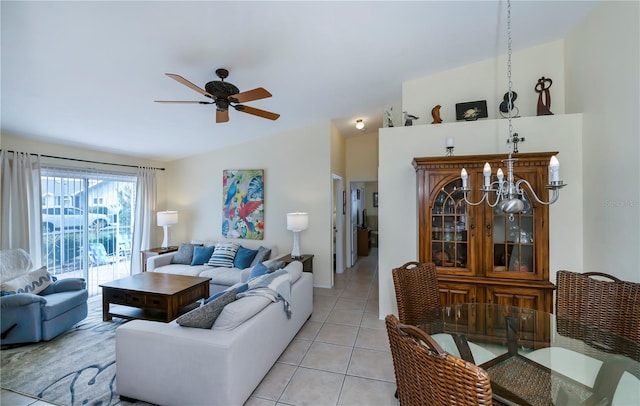 tiled living room with ceiling fan and vaulted ceiling