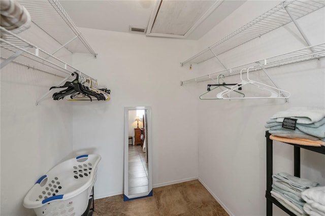 spacious closet with carpet floors