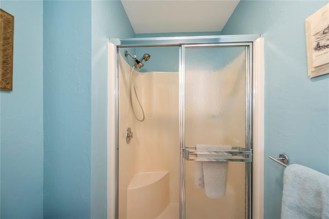 bathroom featuring an enclosed shower