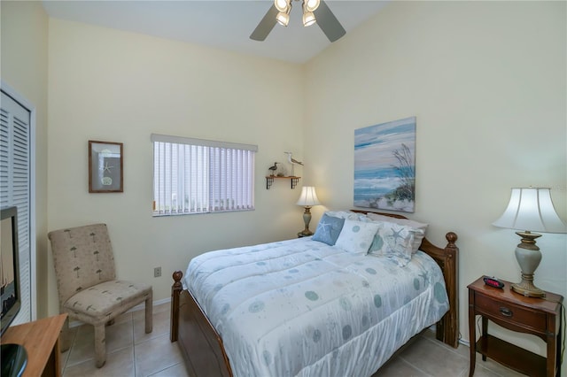 bedroom with ceiling fan and light tile patterned flooring