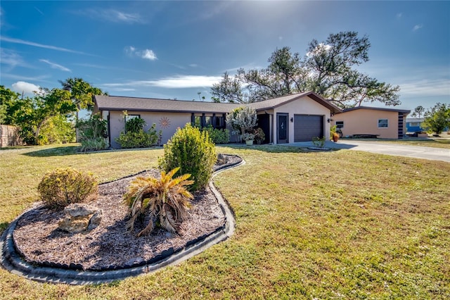 ranch-style house with a garage and a front lawn