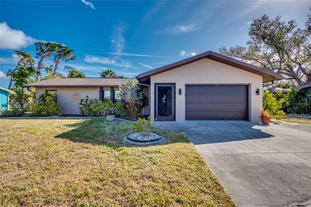 single story home with a front yard and a garage