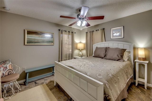 bedroom featuring carpet, a textured ceiling, and ceiling fan