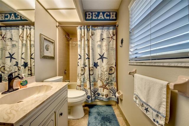 full bathroom featuring tile patterned flooring, shower / tub combo, vanity, and toilet