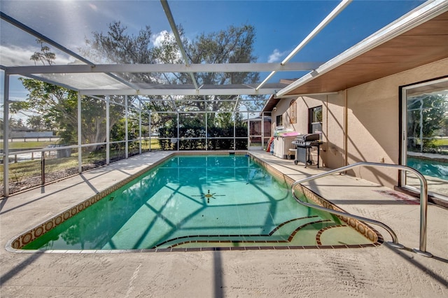 view of swimming pool with a lanai, grilling area, and a patio