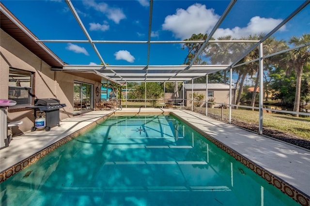 view of pool featuring a patio, grilling area, and a lanai