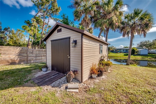 view of outbuilding with a yard