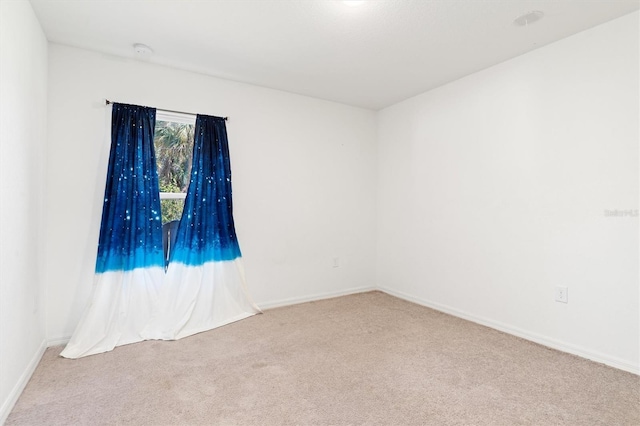 empty room with light colored carpet