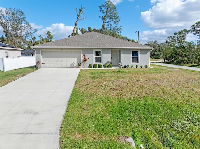 ranch-style home with a front lawn and a garage