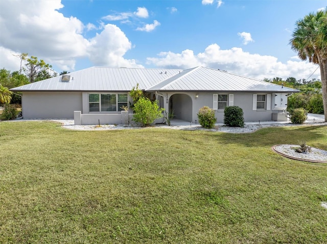 ranch-style home with a front lawn