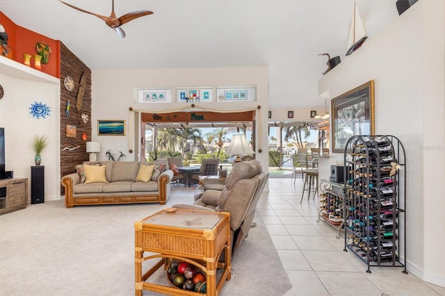 tiled living room with ceiling fan