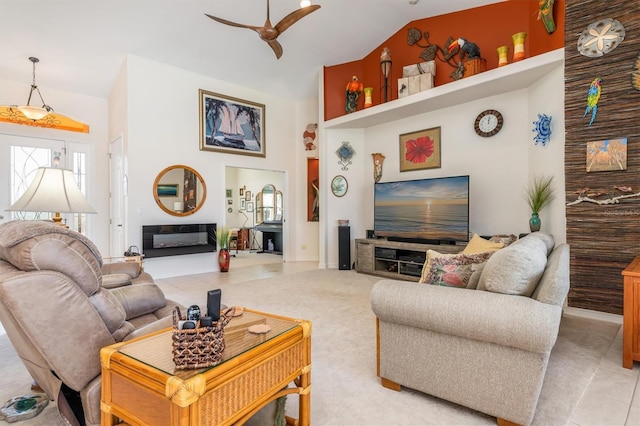 living room featuring tile patterned floors, ceiling fan, and high vaulted ceiling