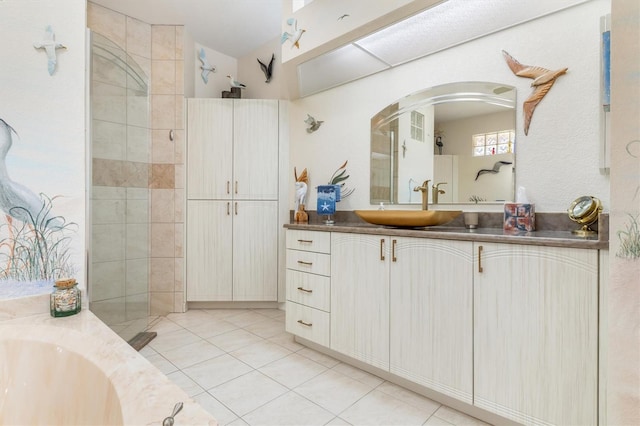 bathroom with tile patterned flooring and vanity