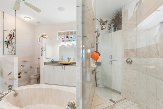 full bathroom featuring separate shower and tub, ceiling fan, vanity, and toilet