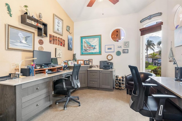 office area featuring light colored carpet, vaulted ceiling, and ceiling fan