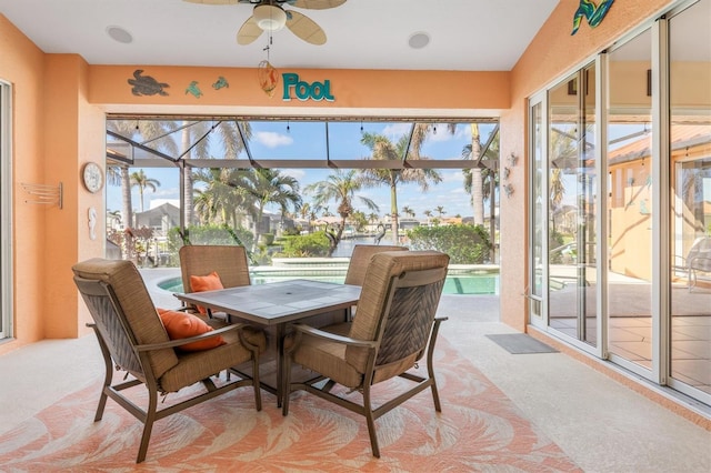 sunroom featuring a wealth of natural light and ceiling fan