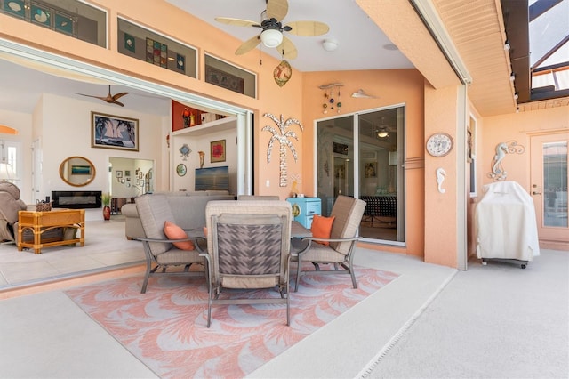 carpeted dining room with lofted ceiling