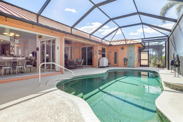 view of pool featuring a lanai and a patio area