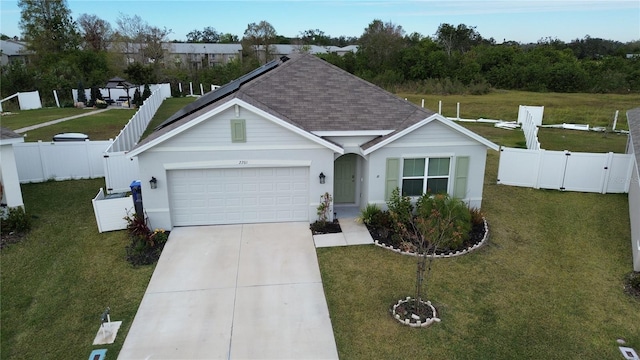 view of front facade featuring a front yard and a garage