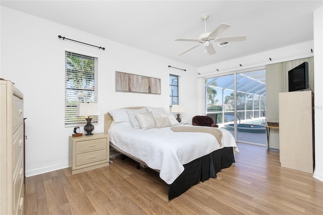 bedroom with access to exterior, ceiling fan, and light hardwood / wood-style flooring