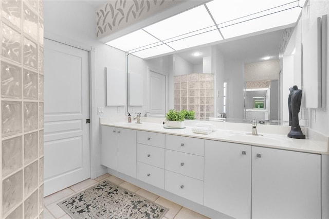 bathroom featuring tile patterned flooring and vanity