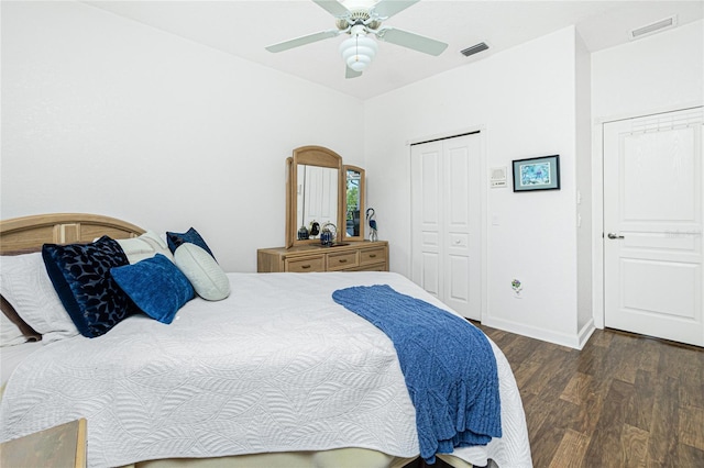 bedroom featuring a closet, dark hardwood / wood-style floors, and ceiling fan