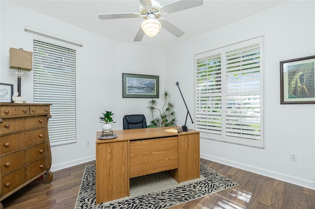 office with dark hardwood / wood-style floors and ceiling fan