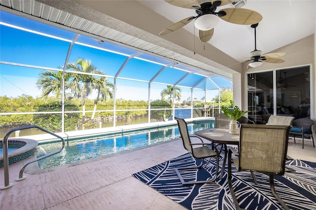 view of swimming pool featuring a lanai, a patio, and an in ground hot tub