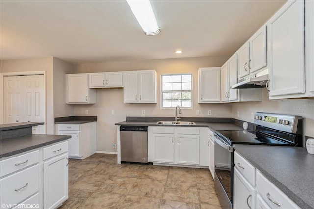 kitchen with white cabinets, appliances with stainless steel finishes, and sink