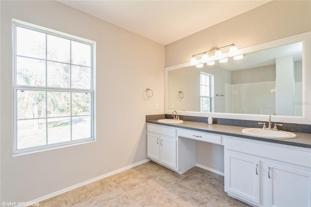 bathroom with vanity and a healthy amount of sunlight