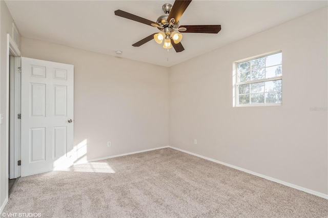 carpeted empty room with ceiling fan