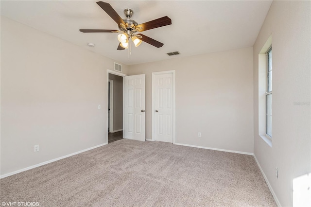 unfurnished room featuring carpet flooring and ceiling fan