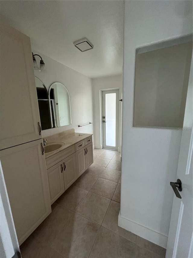 bathroom with tile patterned flooring and vanity