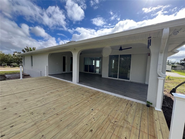 wooden deck with ceiling fan