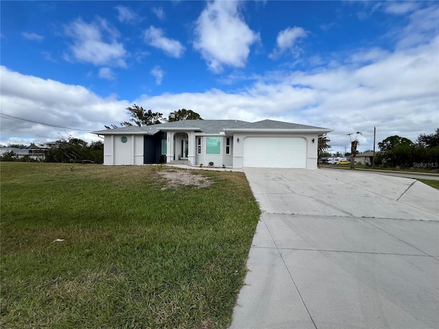 ranch-style house featuring a garage and a front lawn