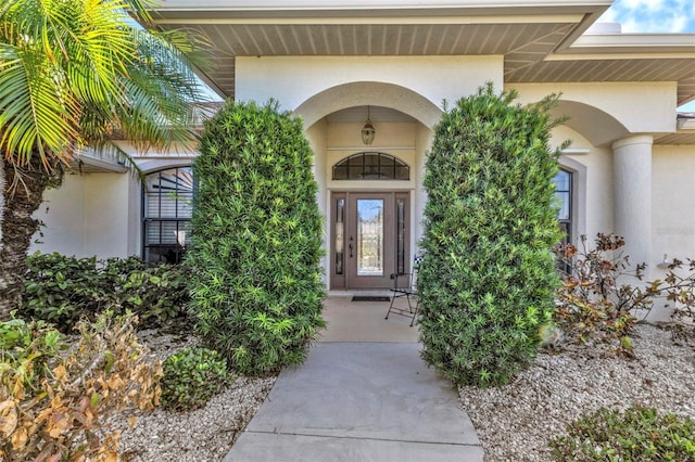 entrance to property with stucco siding